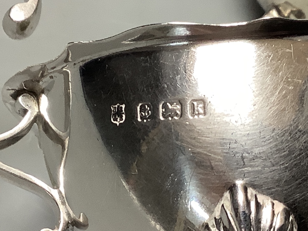 A Britannia silver Christening mug, Sheffield 1931, a pair of silver cream boats, Birmingham 1909 and a small silver sugar bowl approximately 14.6oz